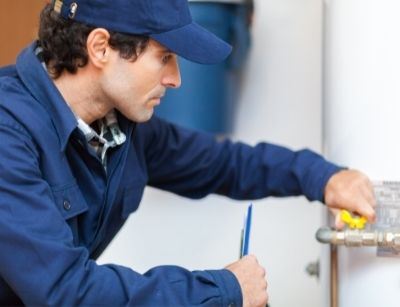 technician working on water heater