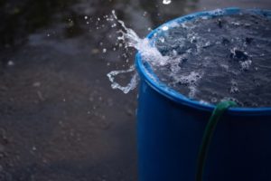 Put a rain barrel on a yard for fun activity on summer